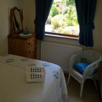 Small room with 4ft double bed and views to the garden.
